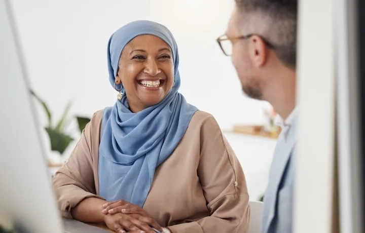 Woman smiling at colleague